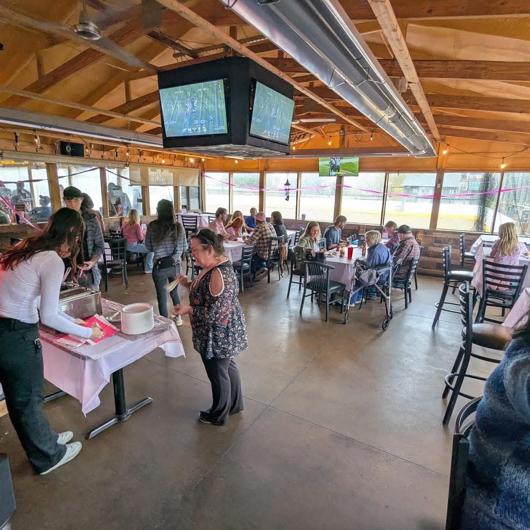 Guests at decorated tables during a party at The Barn in Fenton
